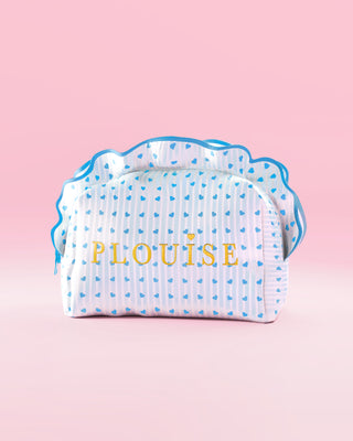 Blue and white striped P.Louise makeup and skincare bag with frills and a blue raspberry design