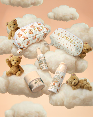 An image of P.Louise The Softest Touch Skincare Starter Kit surrounded by fluffy clouds and teddy bears