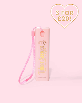 Pink mini P.Louise keychain travel sized  hydrating thirst seeker setting spray against a pink background